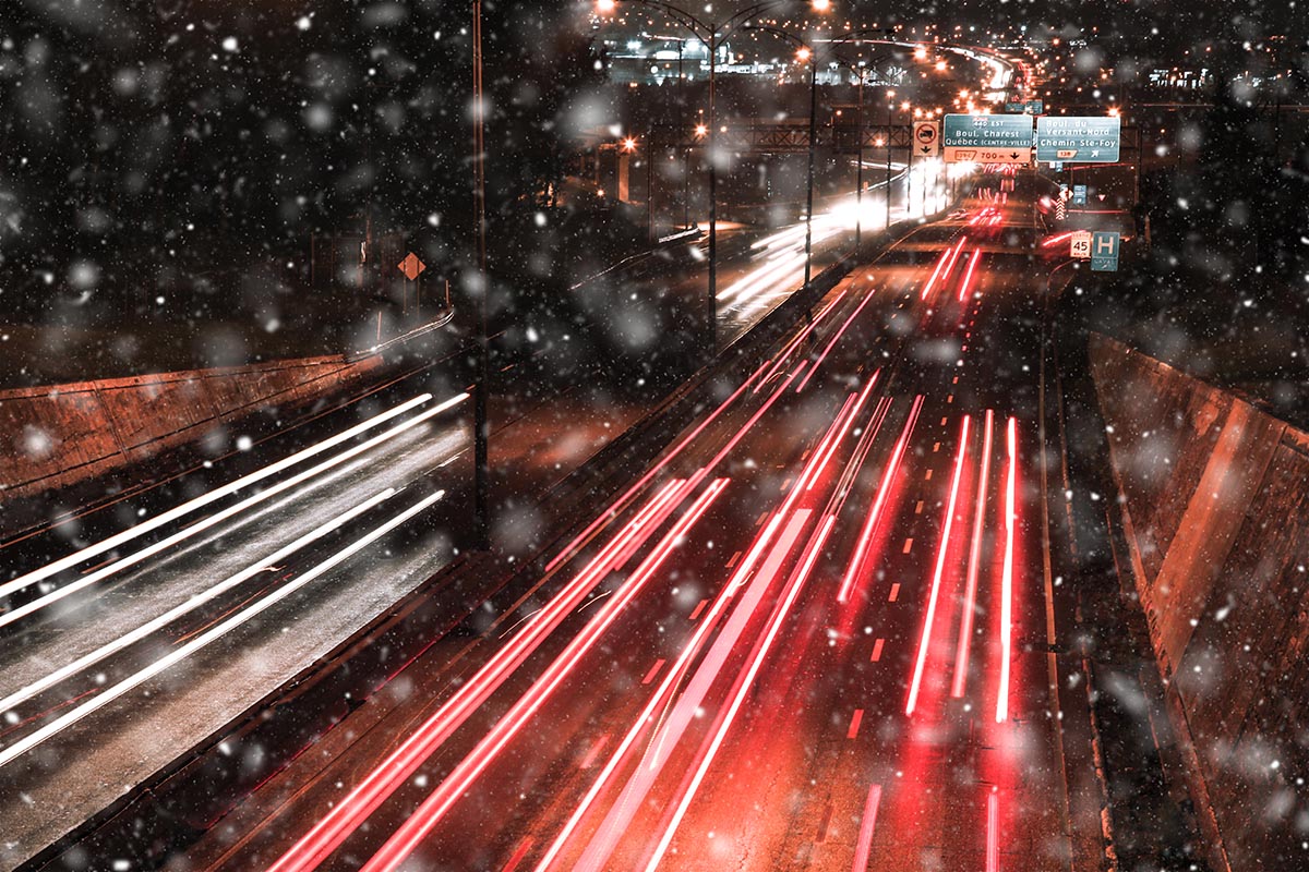 Snowy Highway Traffic at Night